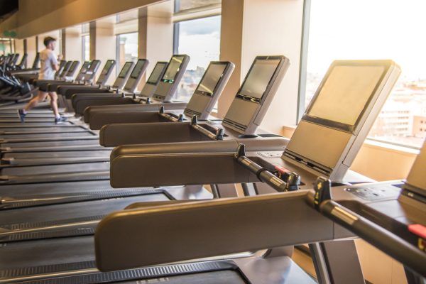 treadmills in a gym with beautiful light from the window gym machines